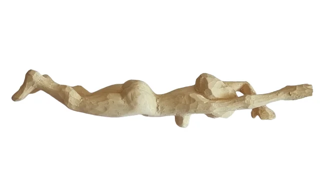 Reclining hand-carved wooden figure by Ilias Toliadis