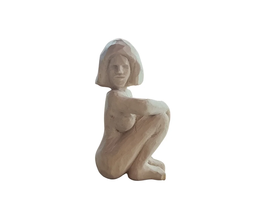 Seated hand-carved wooden figure by Ilias Toliadis