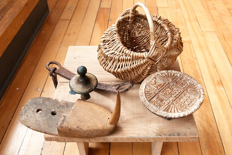 Remembered objects gathered on a stool in Travelling Talismans